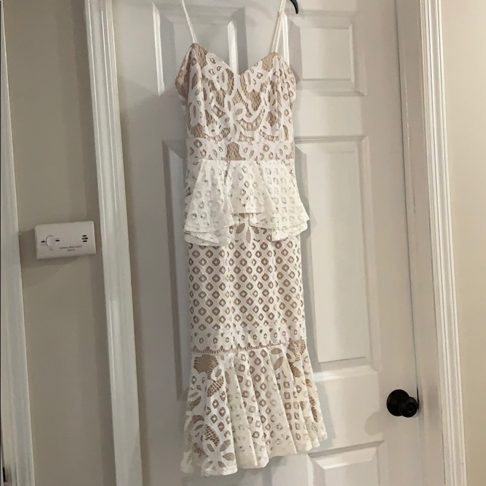 White lace peplum dress with ruffled bottom